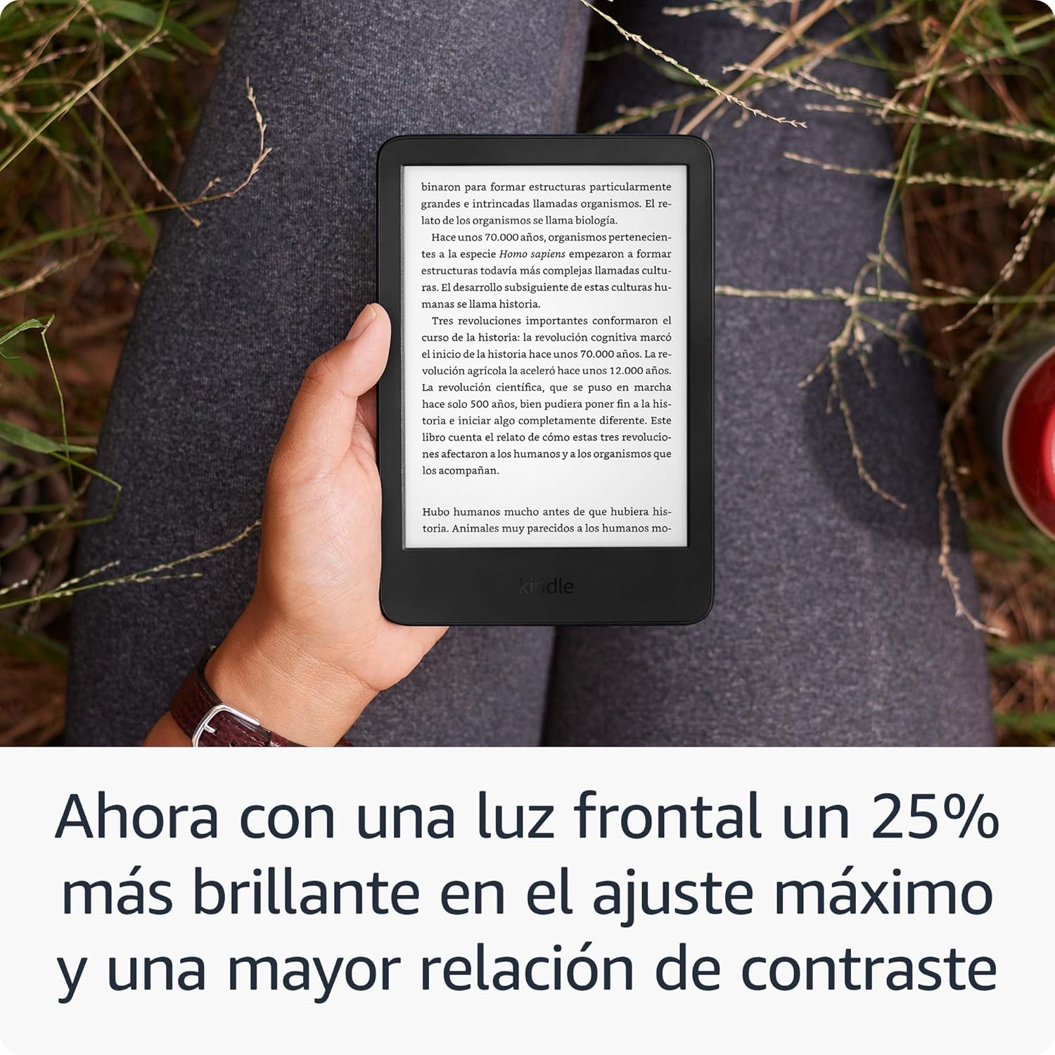 A hand holding the Kindle, illustrating the brighter front light and improved contrast for comfortable reading.