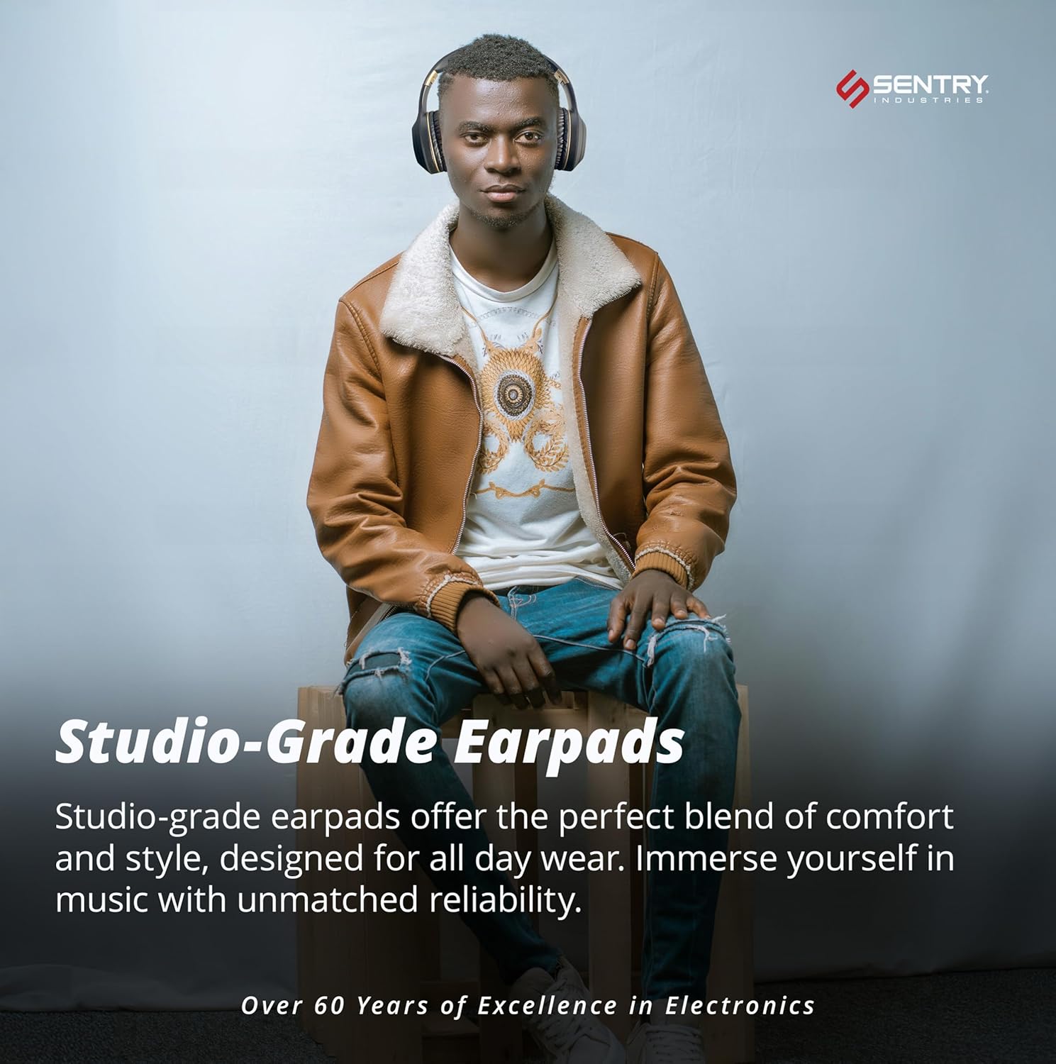 A man sitting and wearing SENTRY OSH headphones, with text emphasizing 'Studio-Grade Earpads' for comfort and reliability.