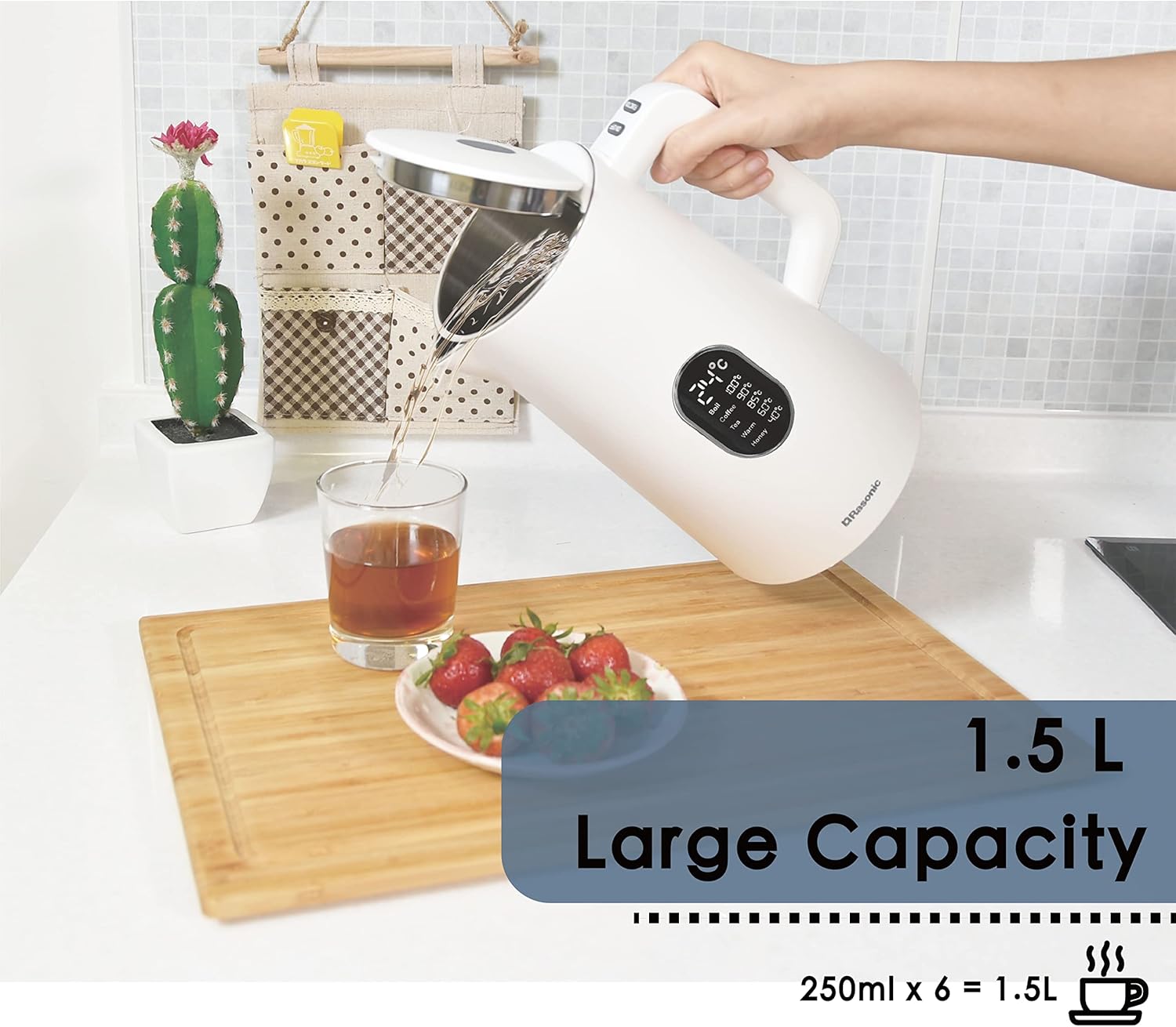 Hand pouring water from Rasonic kettle into a glass, showing 1.5L large capacity.