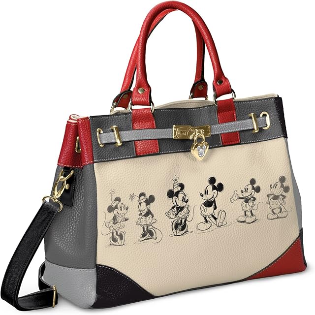 The Bradford Exchange Designer Disney Mickey Mouse And Minnie Mouse Love Story Handbag with a locket-style heart charm featuring a Mickey Mouse silhouette