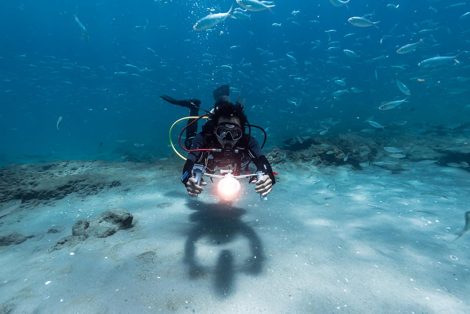 Diver using Aqua Marina Bluedrive X Pro with its nose light illuminated underwater