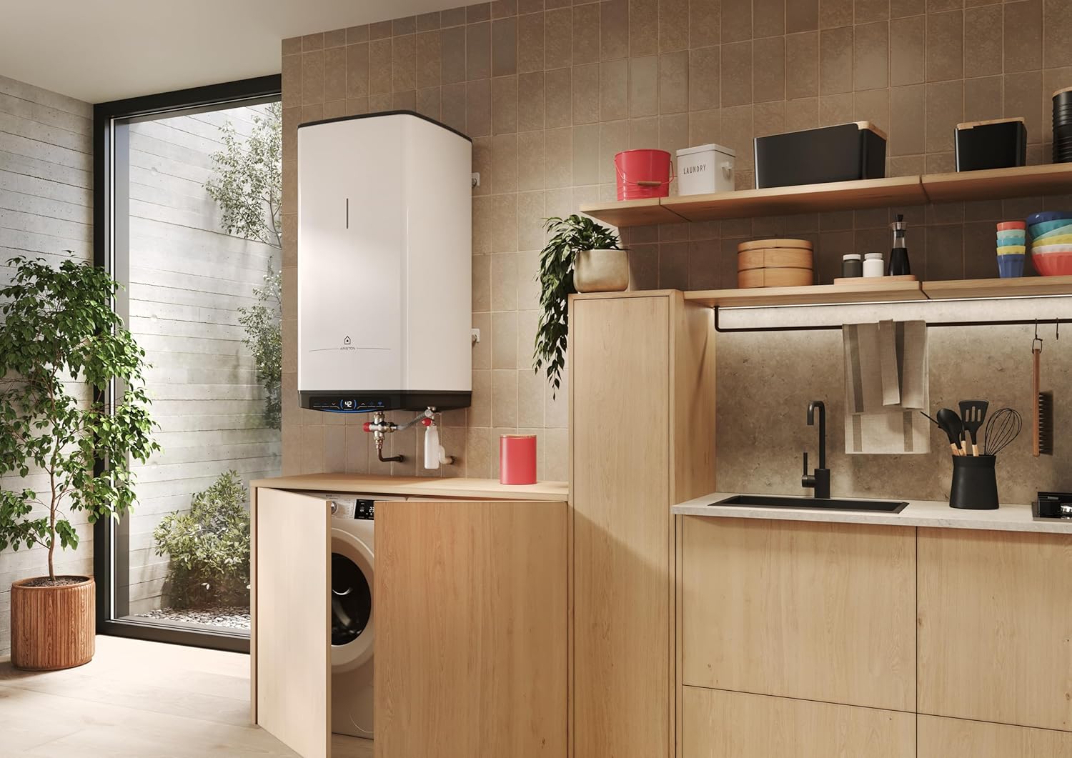 Bottom view of the Ariston Quadris water heater showing water inlet and outlet connections.