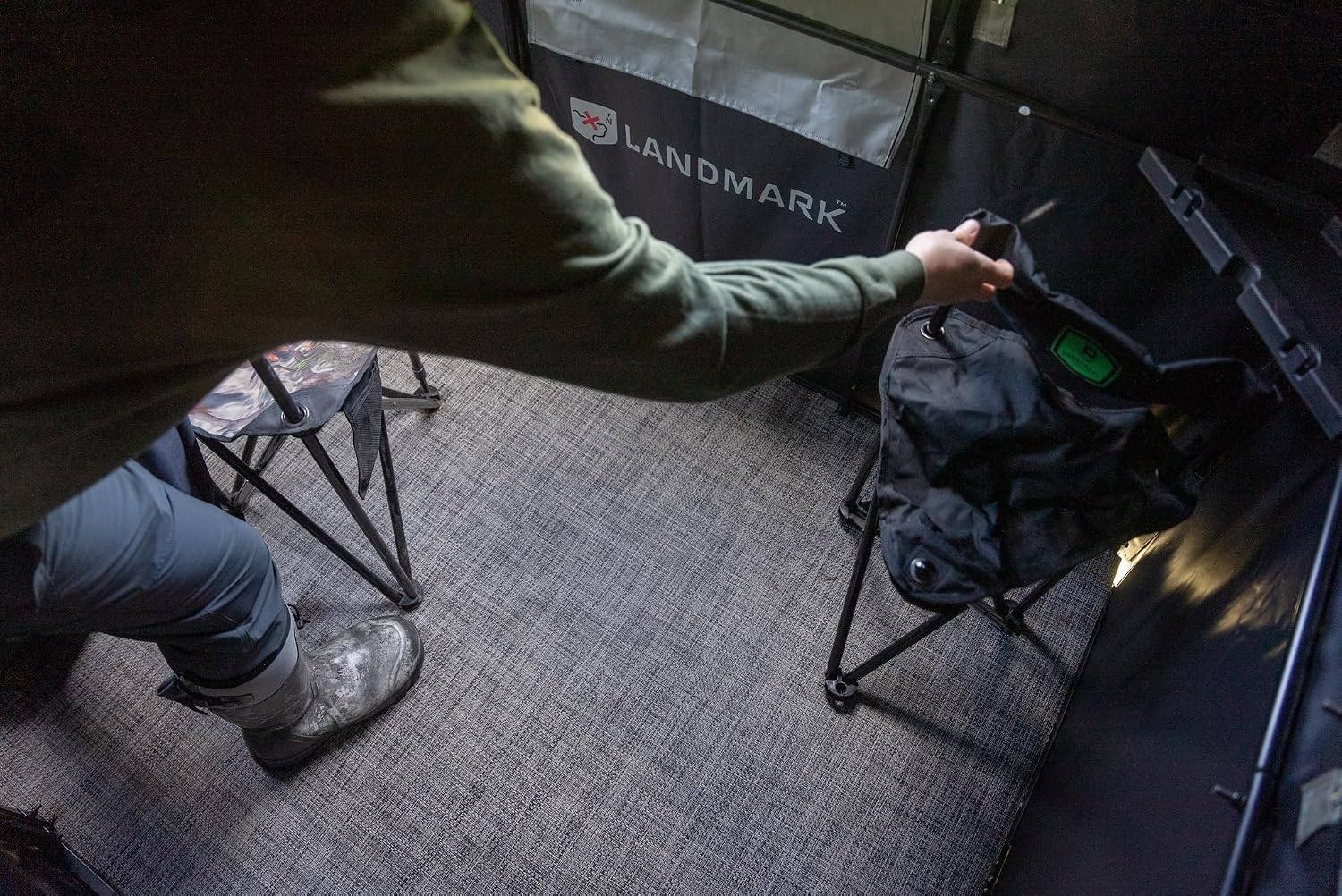 Interior view of the hunting blind showing gear shelves and ample space