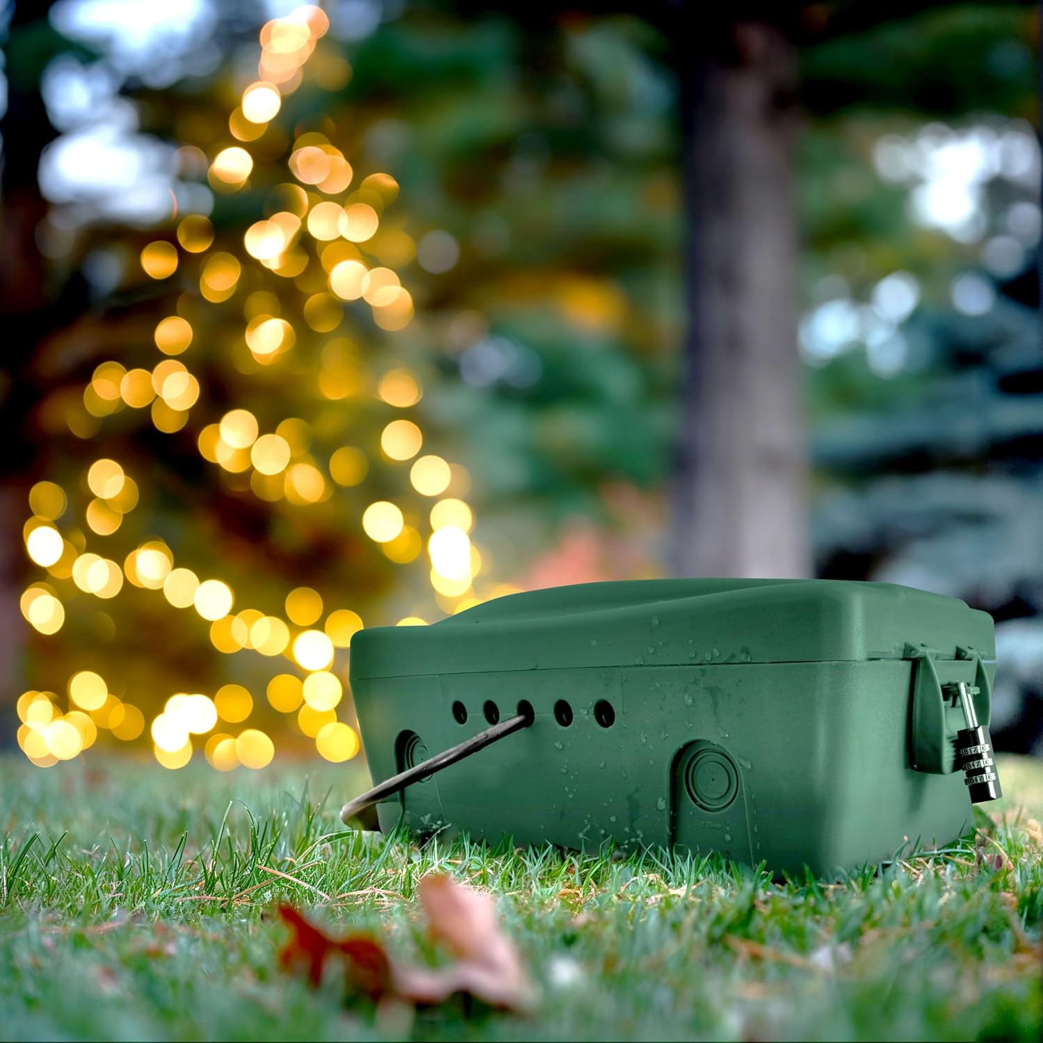 Masterplug Weatherproof Box in use on grass, protecting electrical connections for outdoor Christmas lights.