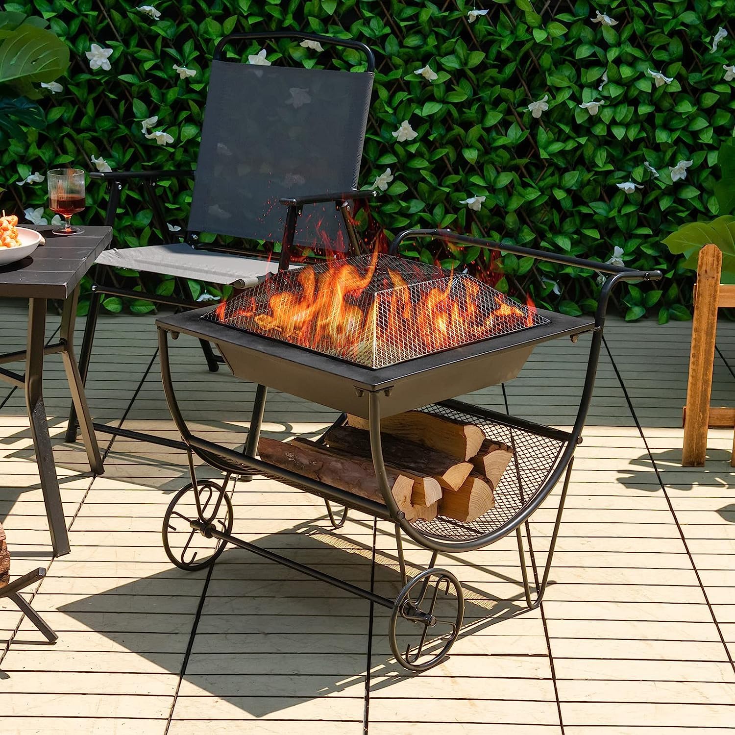 GYMAX Chimenea con Ruedas, Estufa de Leña para Terraza con Estante de Almacenamiento, Bandeja de Fuego, Brasero Exterior Jardin Portátil para Leña para Hogueras, Camping y Picnic, Negro