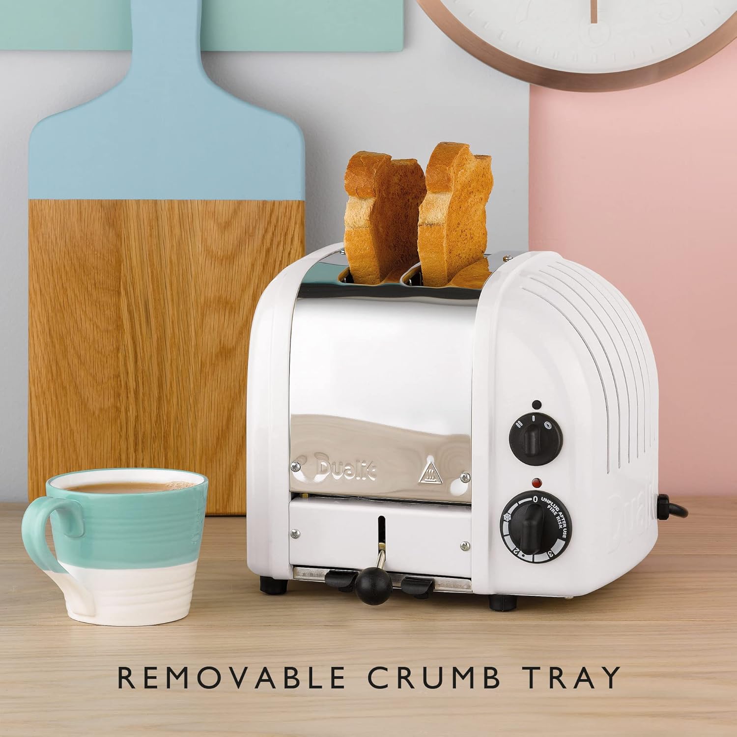 Close-up of Dualit Classic Toaster showing the removable crumb tray and control dials