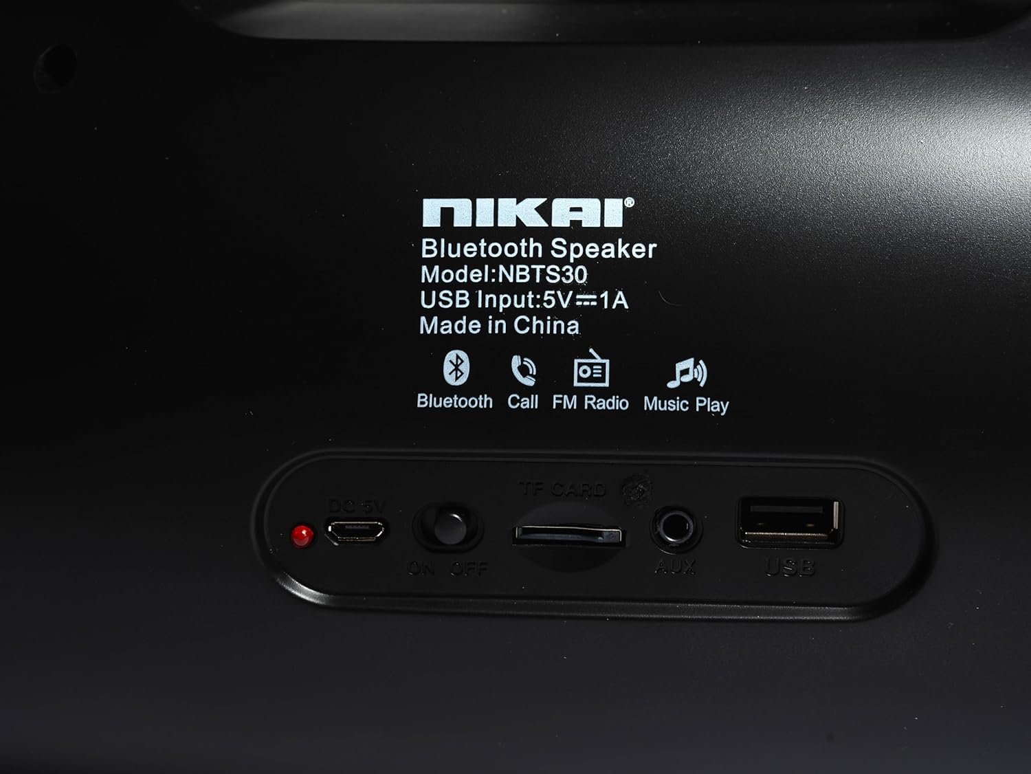 Nikai NBTS30 speaker rear panel with charging port, TF card slot, AUX input, and USB port