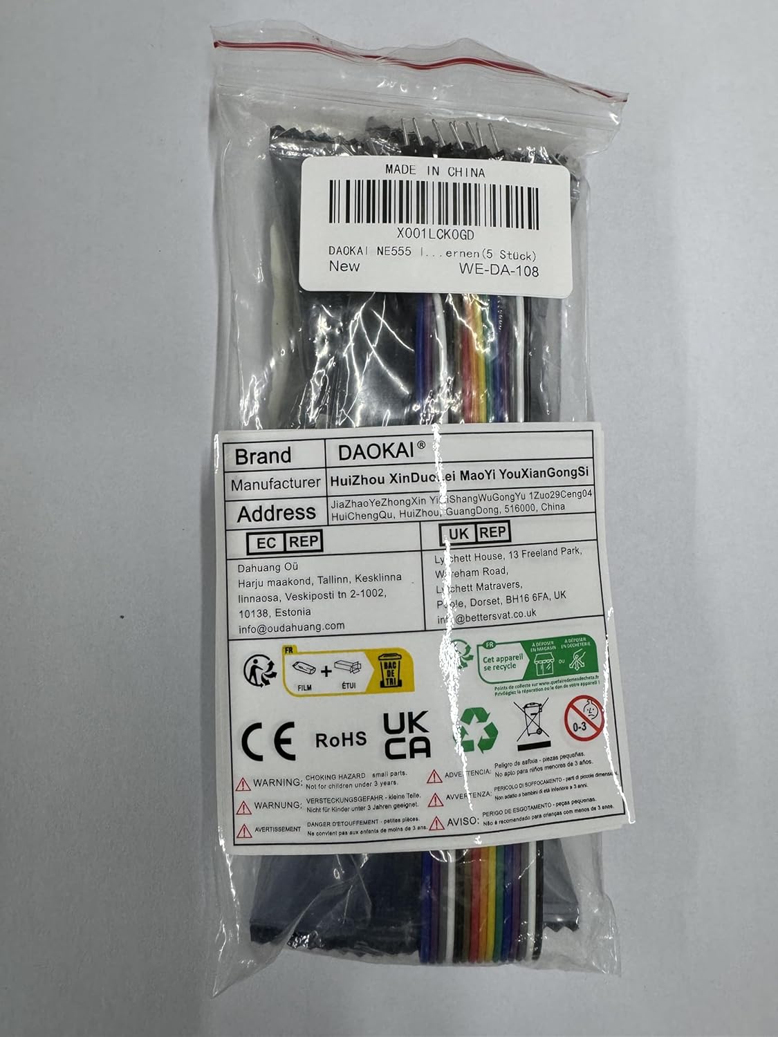 A clear plastic bag containing five NE555 Pulse Generator Modules and a Dupont cable, with a label showing product information.