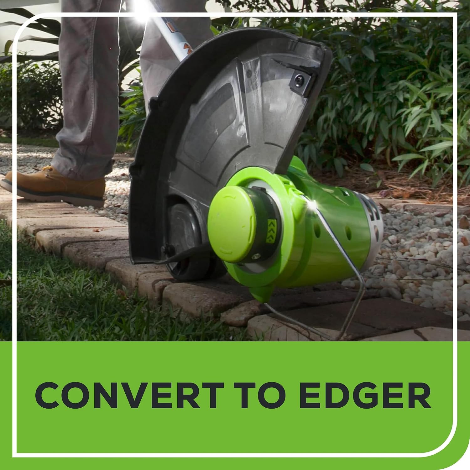 Greenworks string trimmer converted to edger mode, with the edging wheel on a paved surface.