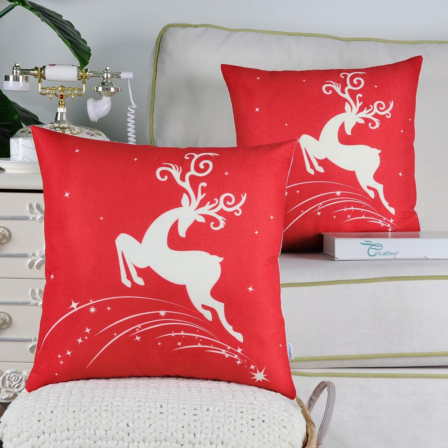 CaliTime Pack of 2 Soft Canvas Throw Pillow Covers Cases for Couch Sofa Home Decoration Christmas Holiday Reindeer Jump with Stars Print 16 X 16 Inches Christmas Red