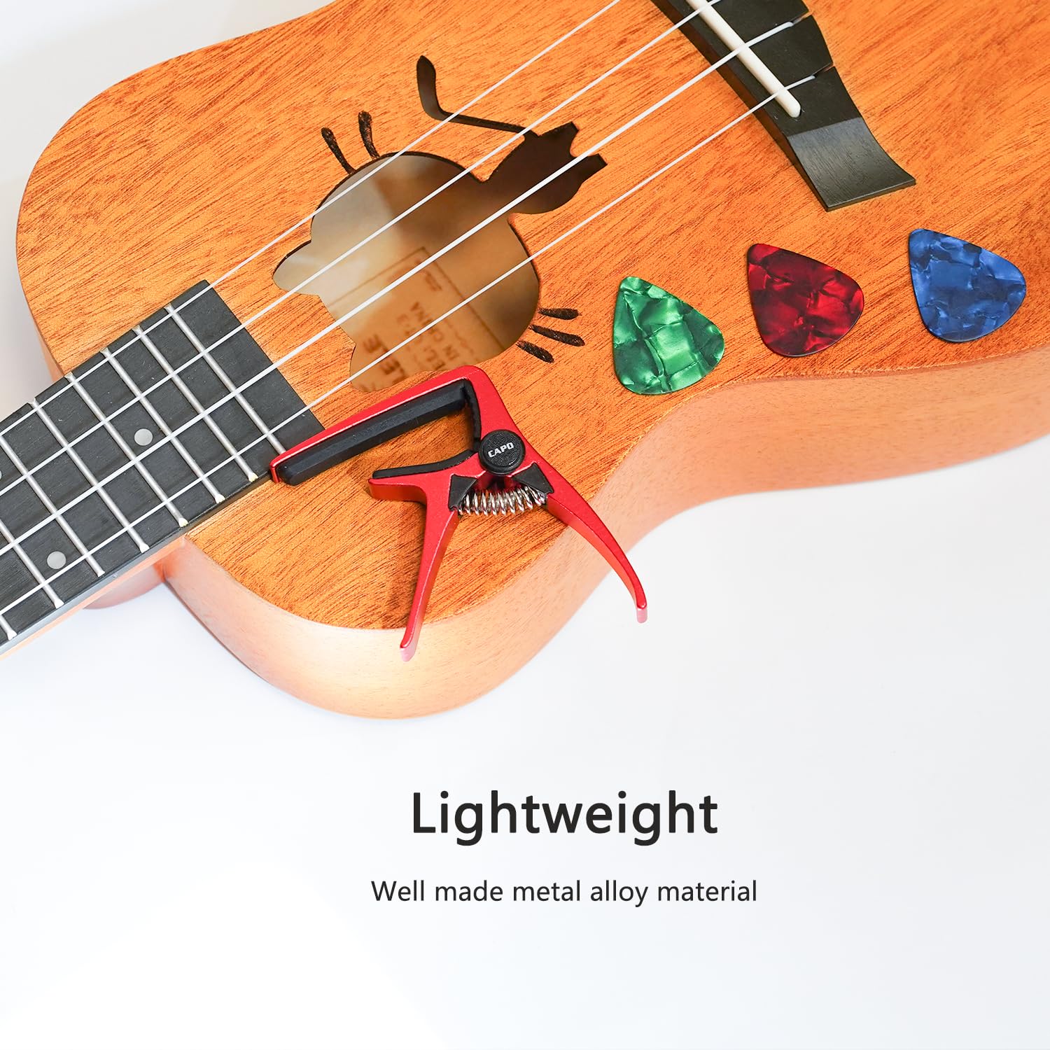 Kapodaster ukulele na 4-strunową gitarę i mandolinę, mini rozmiar profesjonalne ukulele kapodaster czerwony
