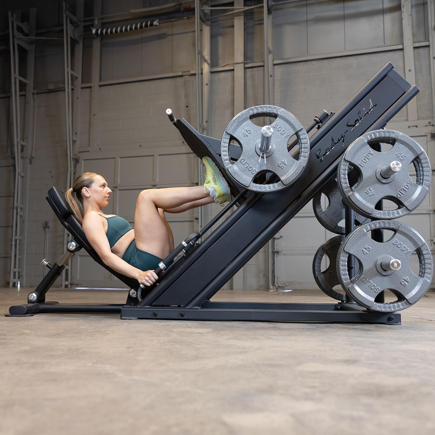 Woman performing leg press exercise on Body-Solid SGLP500
