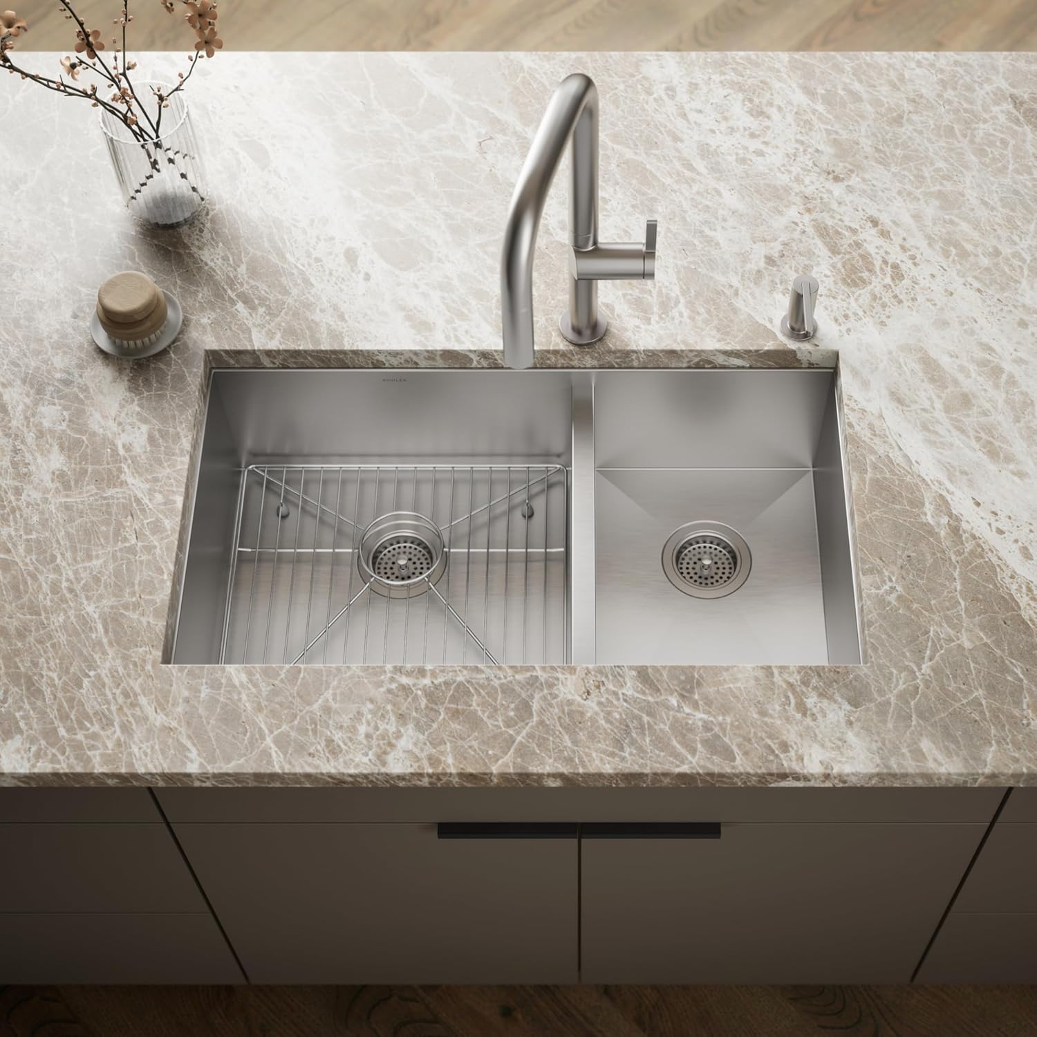 KOHLER Vault sink installed in a kitchen countertop with a faucet and soap dispenser.