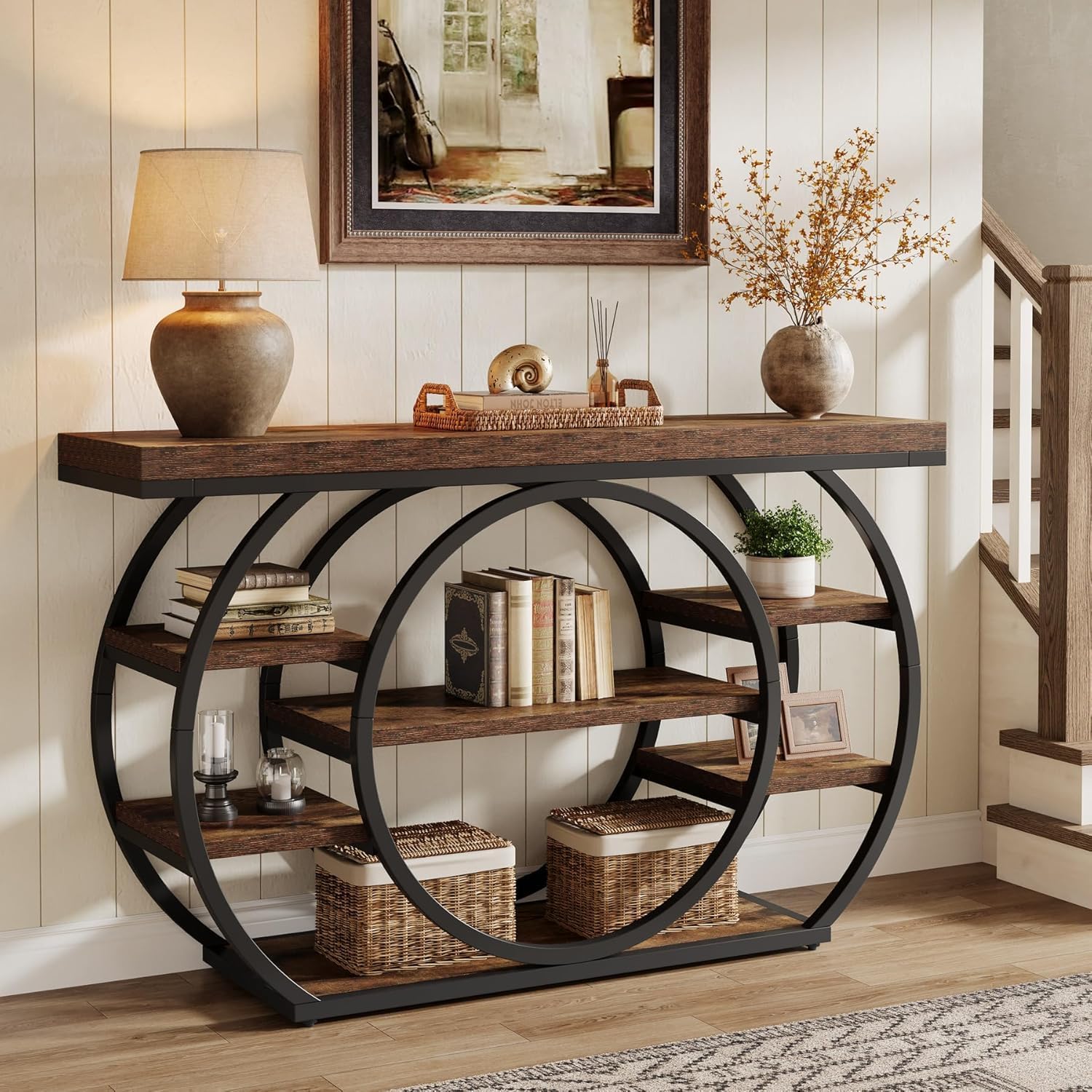 Tribesigns console table in an entryway, decorated with a lamp, books, and baskets.