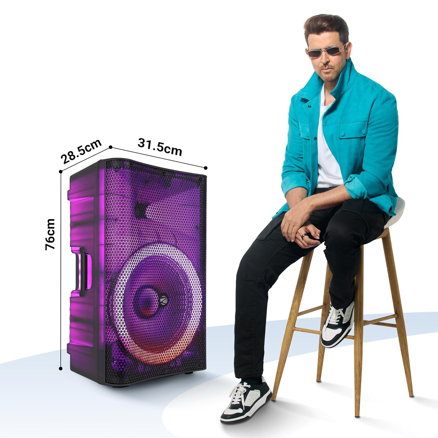 ZEB-GLOW BOX 15A speaker with dimensions 28.5cm width, 31.5cm depth, 76cm height, next to a person for scale.