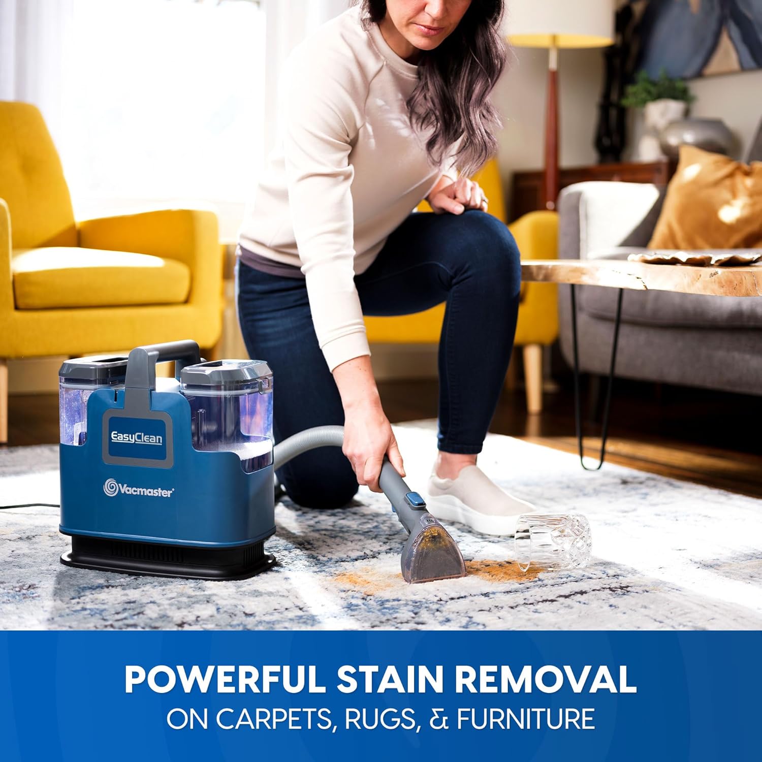 Woman cleaning a stain on a rug with the Vacmaster SCB0501