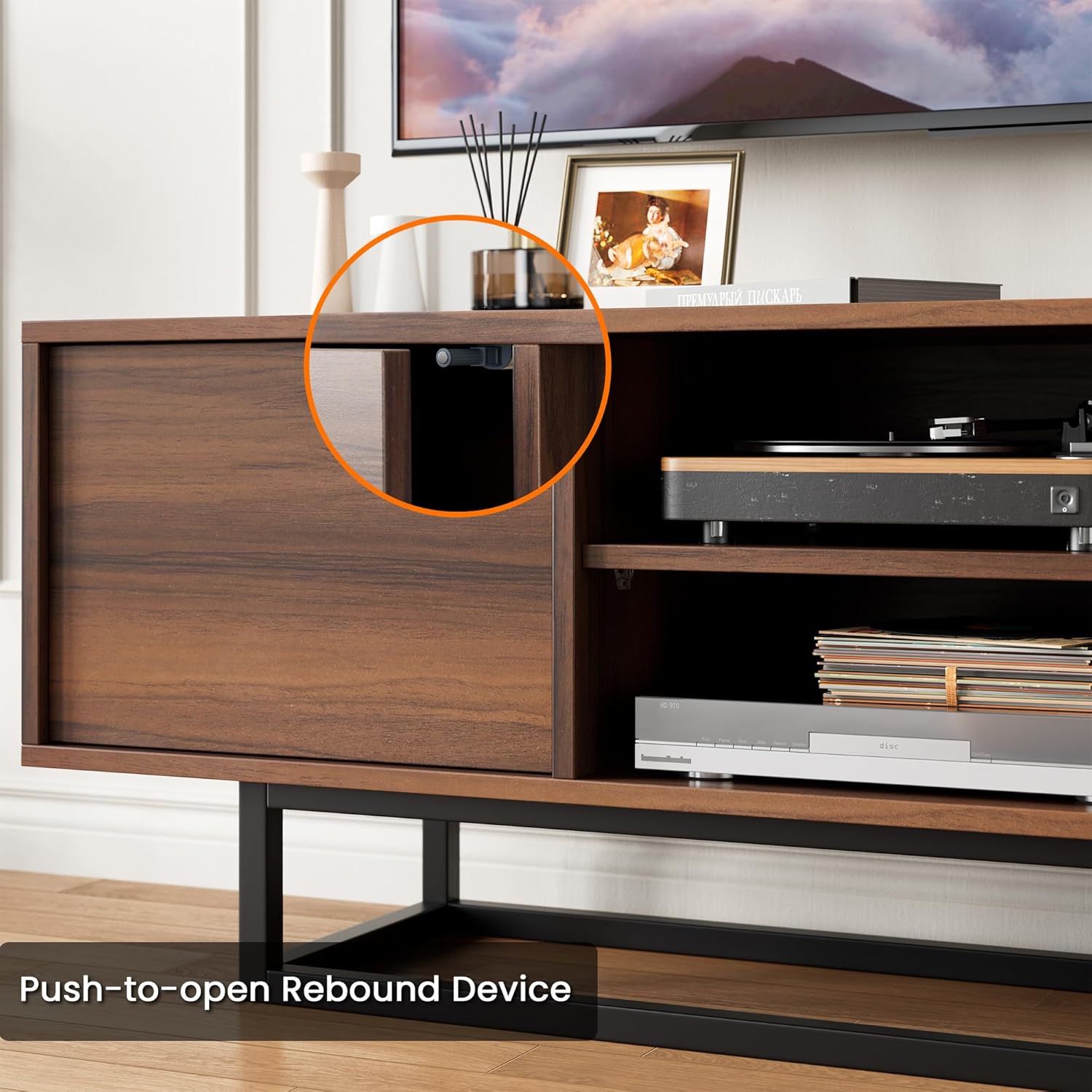 Close-up of the push-to-open rebound device on the TV stand door