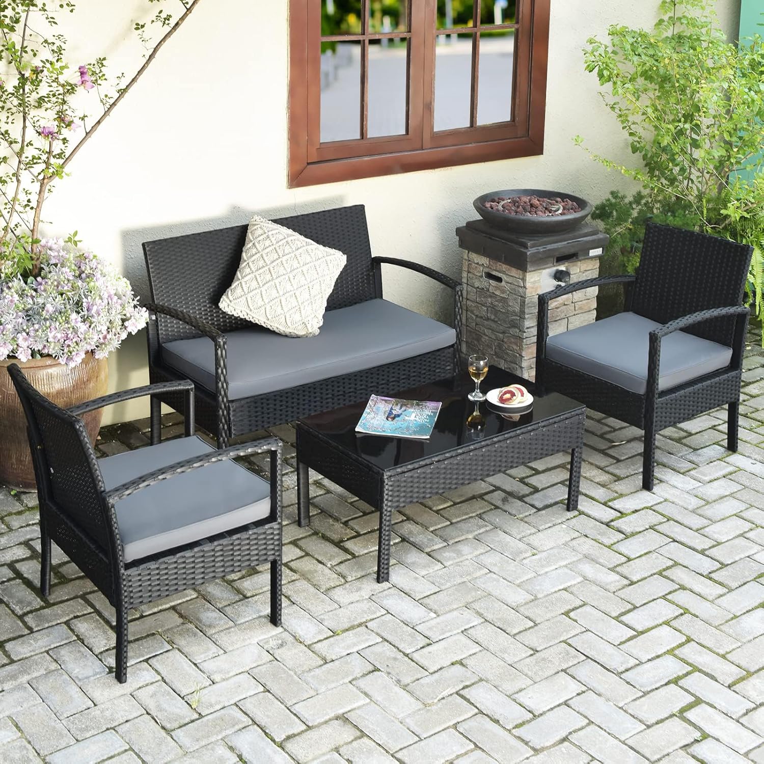 Detailed view of DORTALA patio furniture components, highlighting hand-crafted PE rattan, soft and waterproof sponge cushion, ergonomic armrest, and solid leg with protective pads.