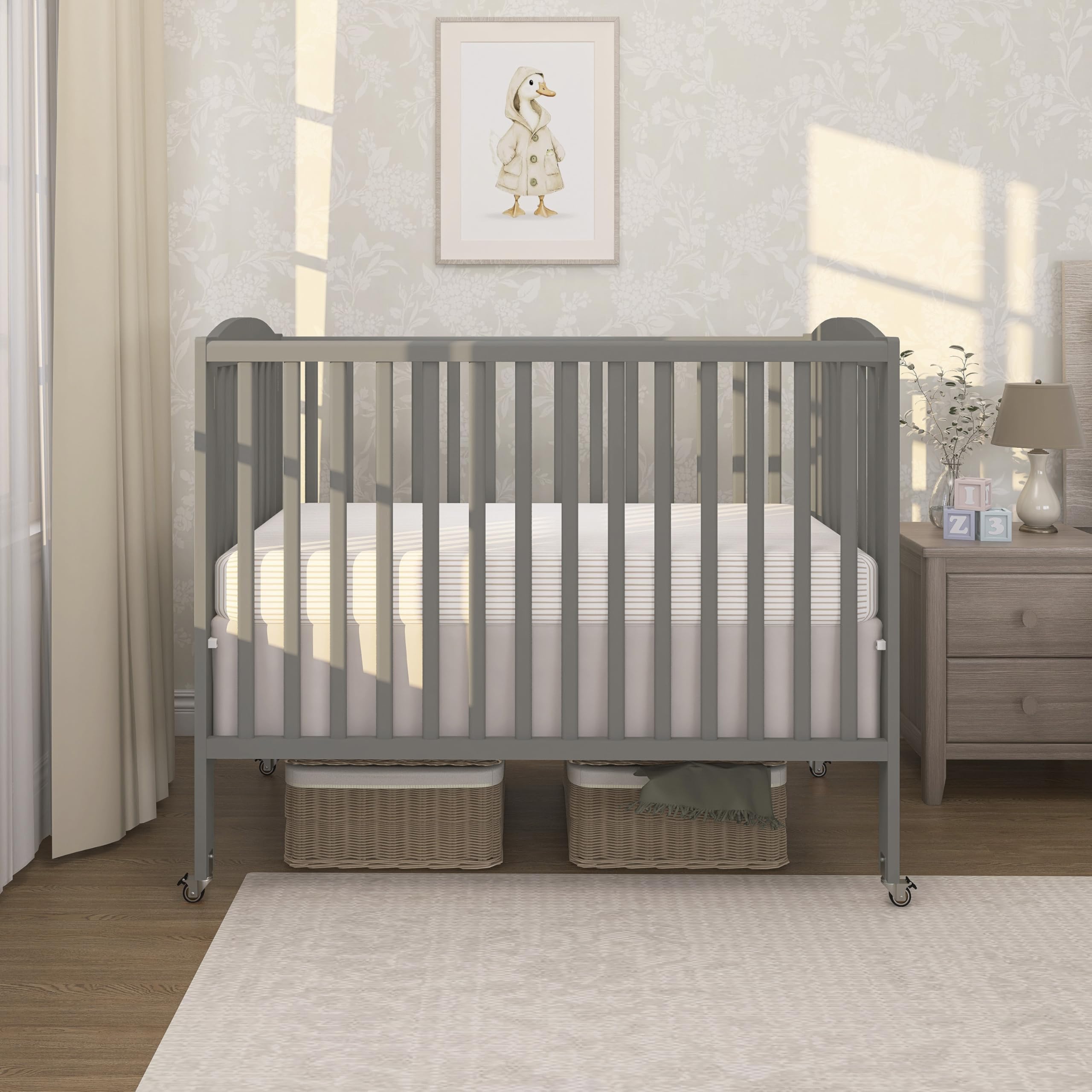 dream on me full-size 2-in-1 folding baby crib in steel grey, greenguard gold & jpma, portable, patented quick folding system, strong wheels, 2 adjustable mattress heights