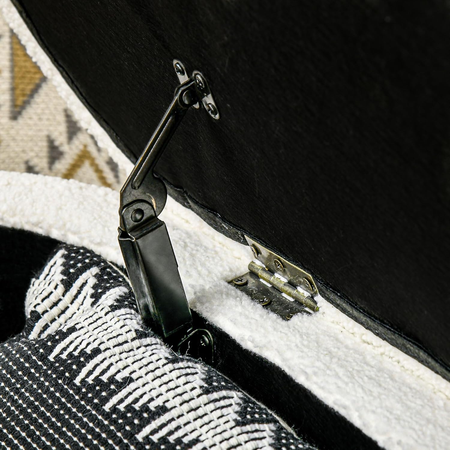 Close-up of the hinge mechanism for the lid of the HOMCOM Storage Ottoman Bench.