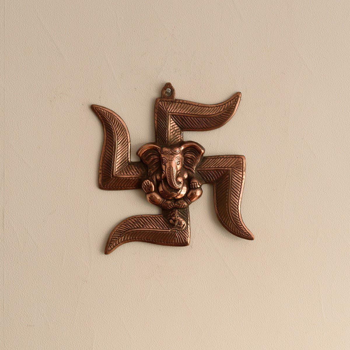 eCraftIndia Lord Ganesha on Swastik Metal Wall Hanging (22 cm x 3 cm x 24 cm, Brown)