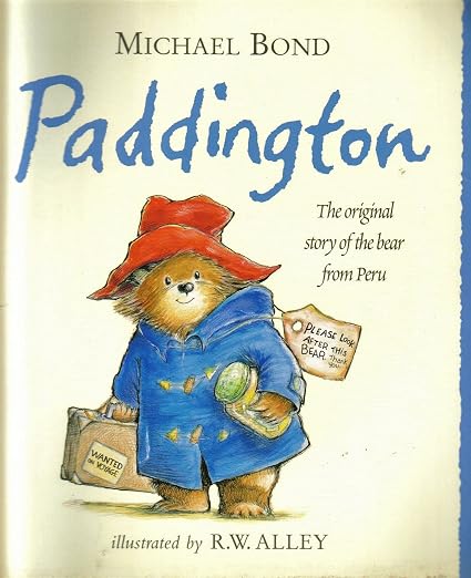 Paddington by Michael Bond book cover featuring a bear in a blue coat and red hat holding a suitcase and labeled "Please look after this bear."