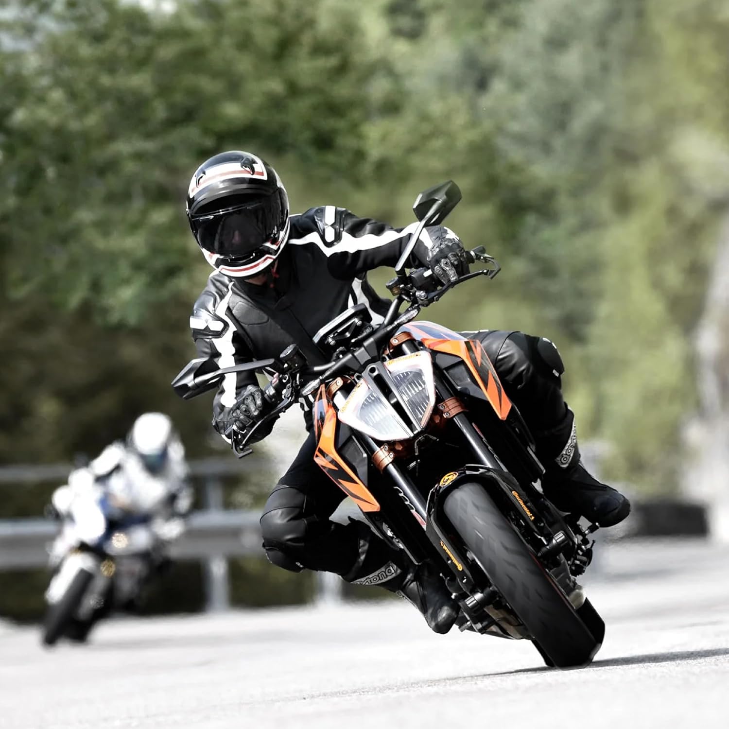 Motorcycle riding on road, demonstrating tire performance