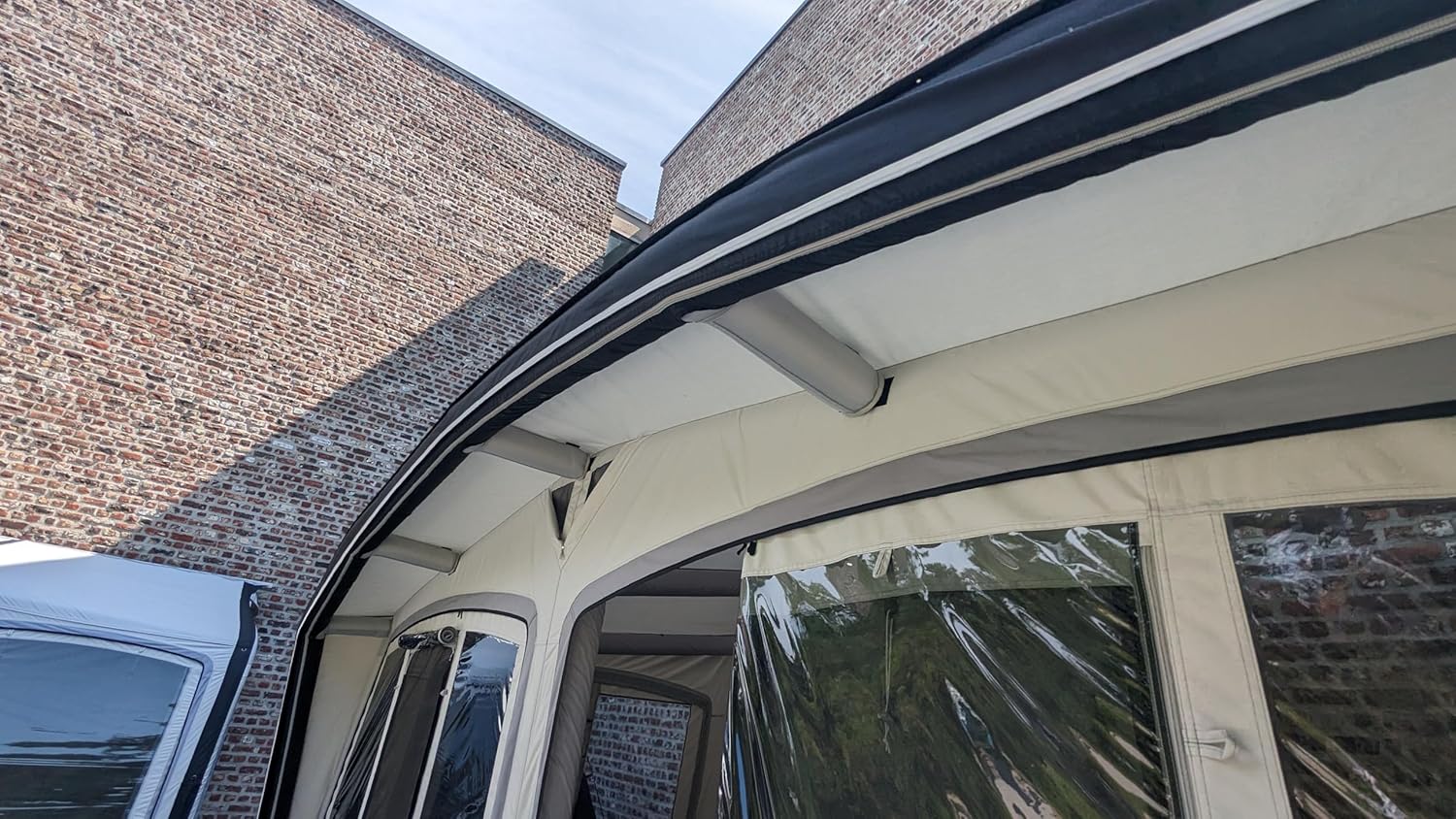 Close-up of the tent's roof and connection point to a vehicle.