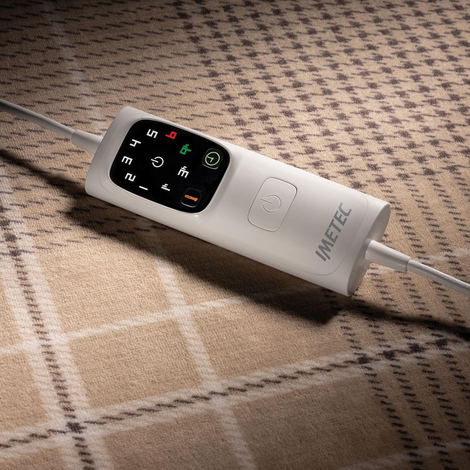 Close-up of the Imetec heated throw's digital control unit