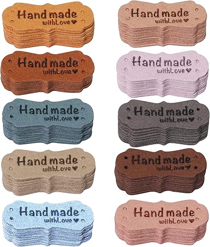 TXIN 100 etiquetas hechas a mano para artículos de ganchillo, etiquetas de piel sintética con corazones para coser en forma de corazón, con agujeros