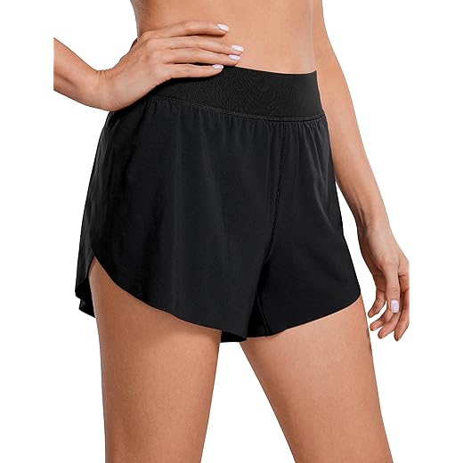 CRZ YOGA Mid Waisted Dolphin Athletic Shorts for Women Lightweight High Split Gym Workout Shorts with Liner Quick Dry