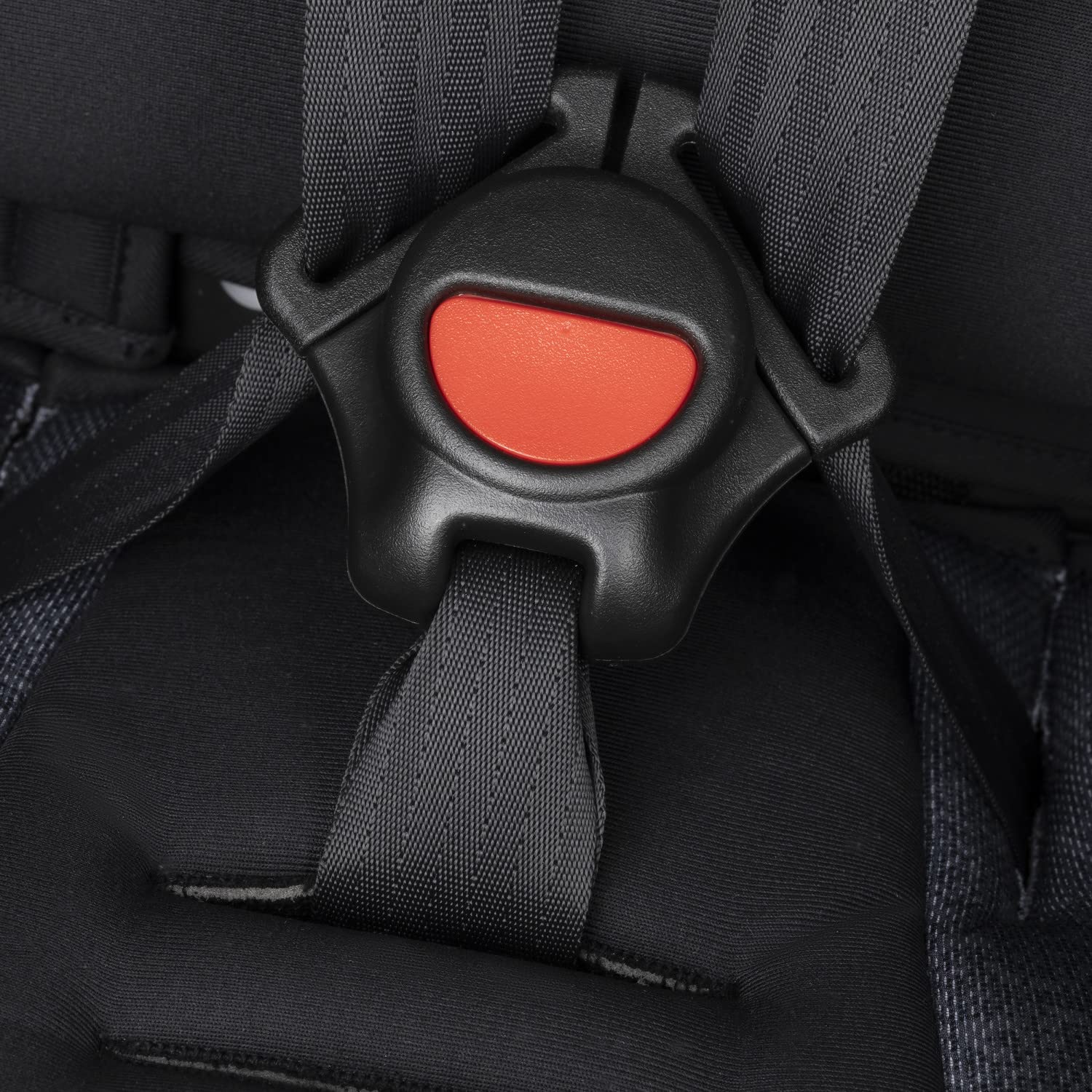 Close-up of the car seat's crotch buckle with a red release button