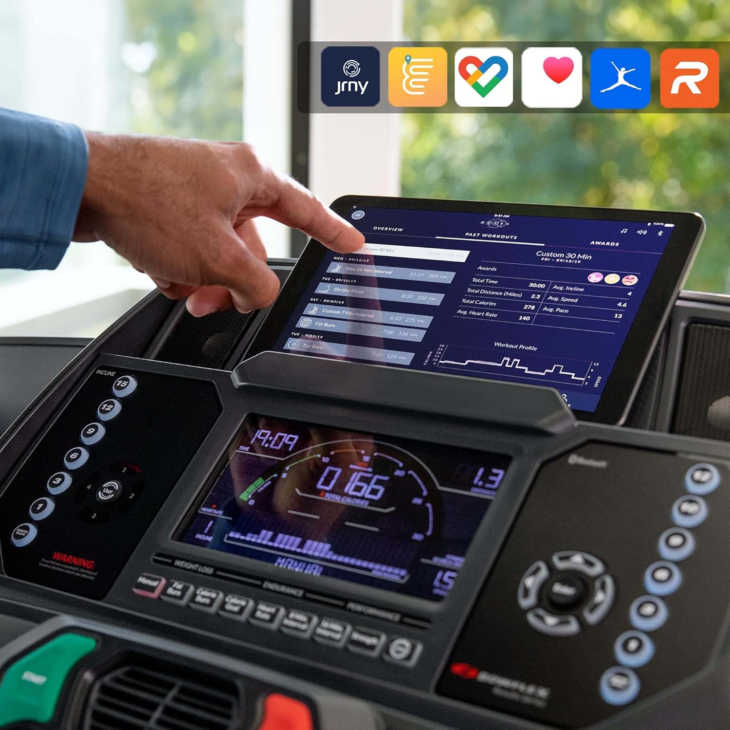 Bowflex BXT226 Treadmill with tablet showing fitness apps