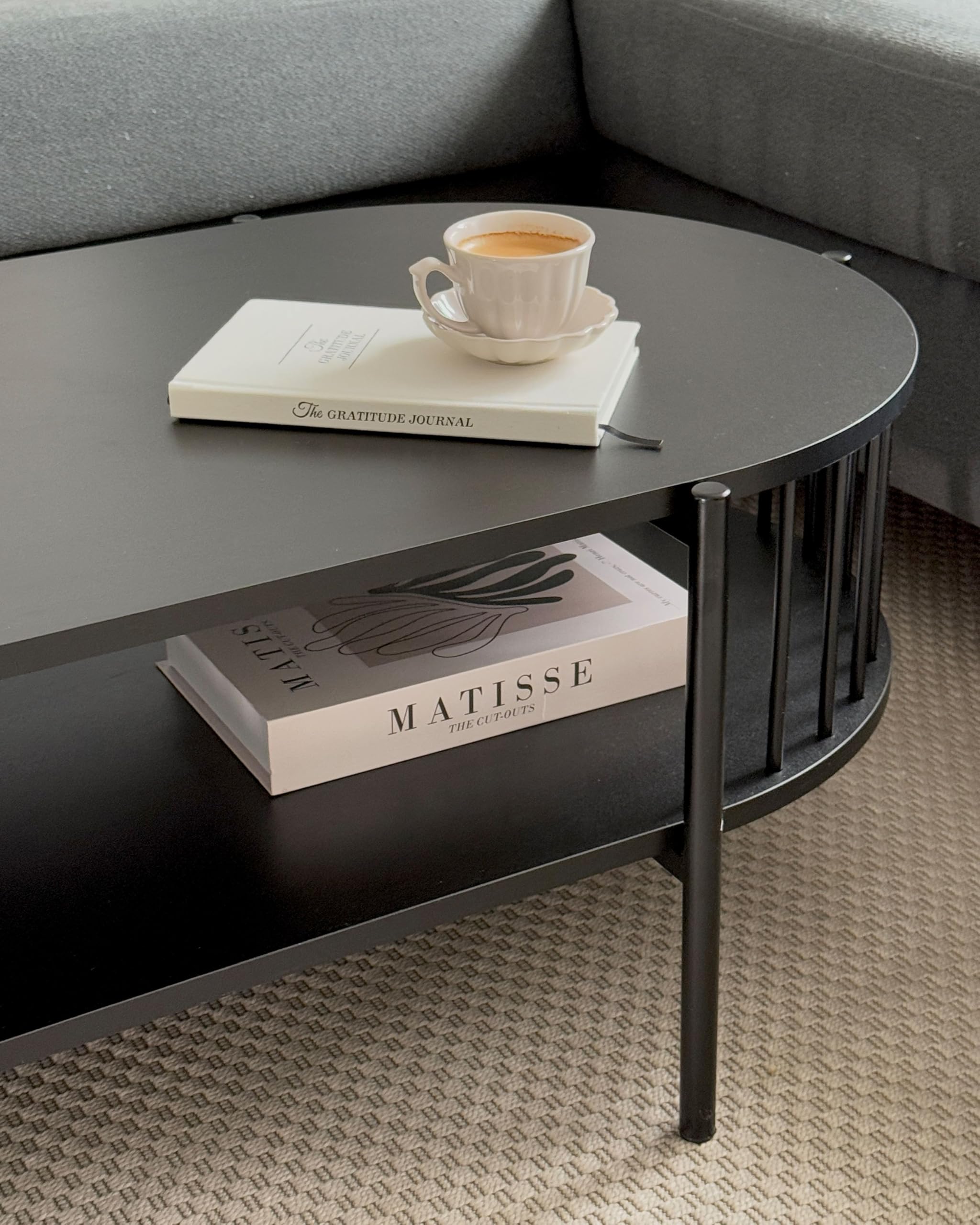 Beliani Couchtisch oval schwarz mit Metallbeinen Ablagefach offene Gitter-Optik Oreana