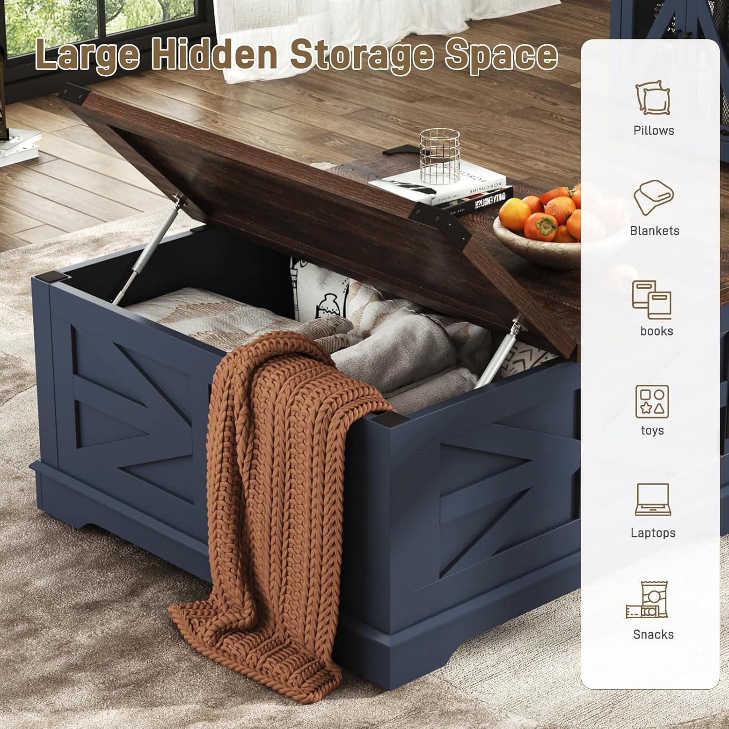 The coffee table with its top lifted, revealing a large hidden storage space filled with blankets, pillows, books, and other items.