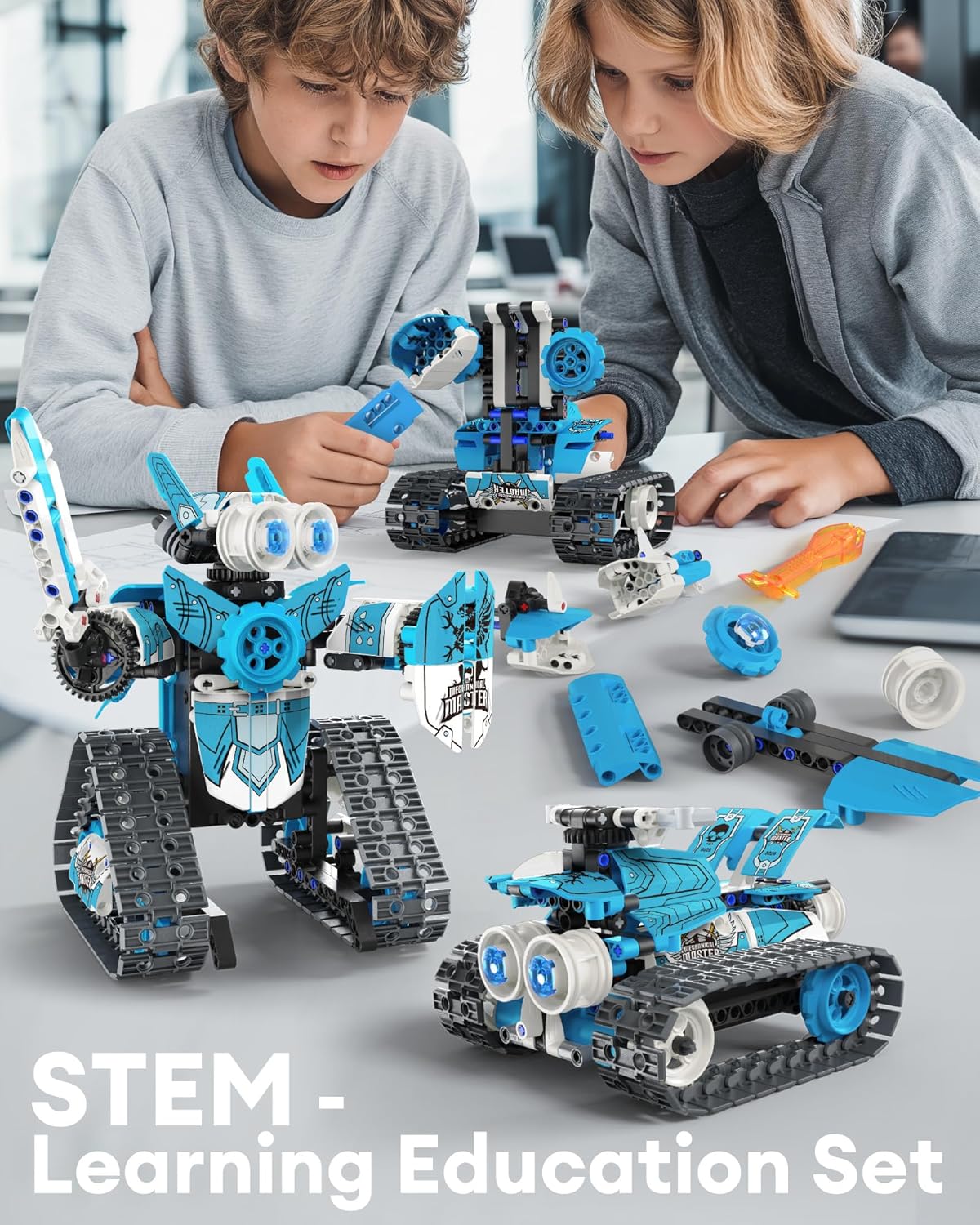 Two children assembling the robot building kit