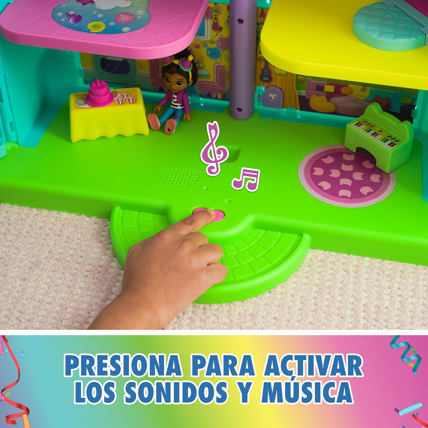 Hand pressing the sound activation button on the dollhouse base