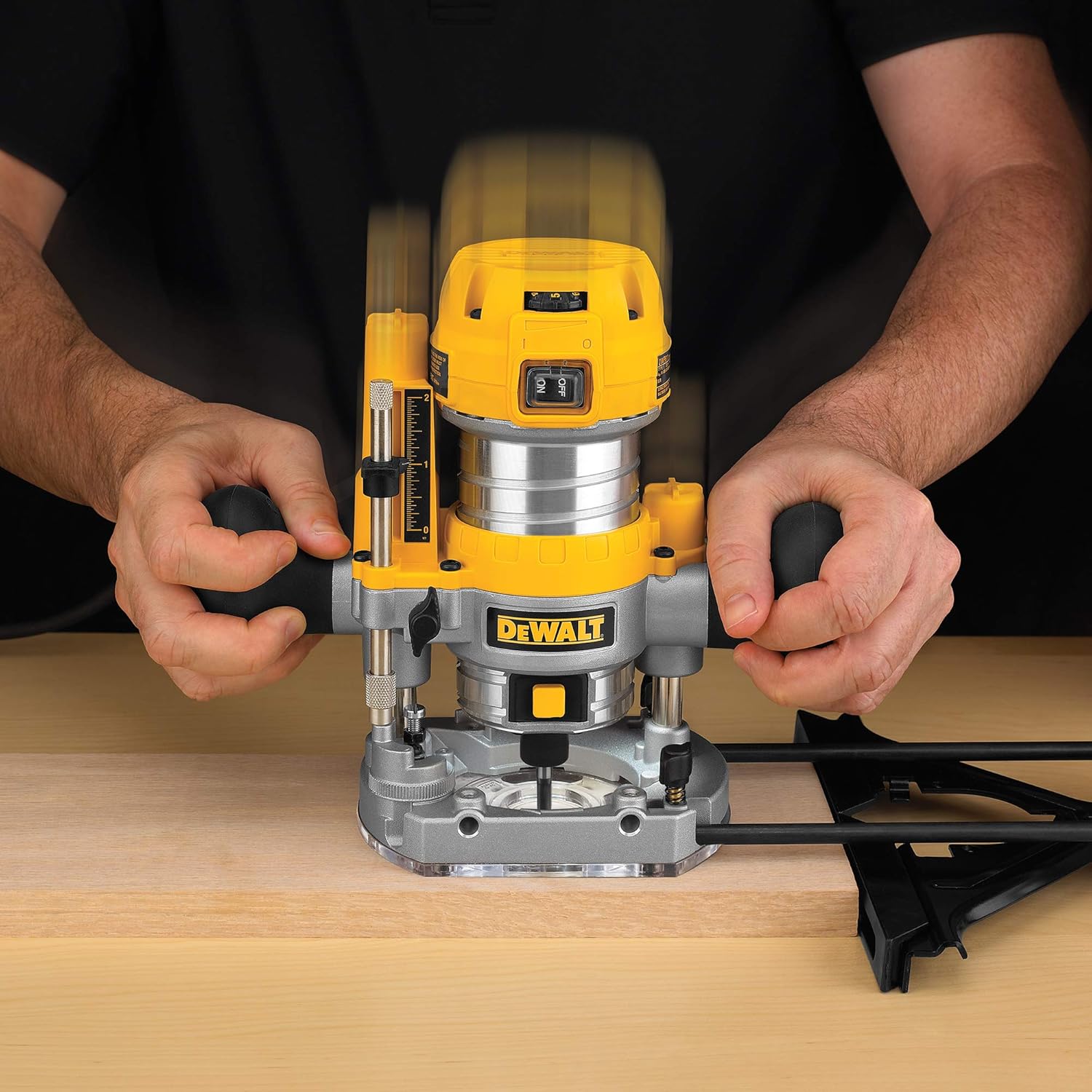 User operating DEWALT plunge router