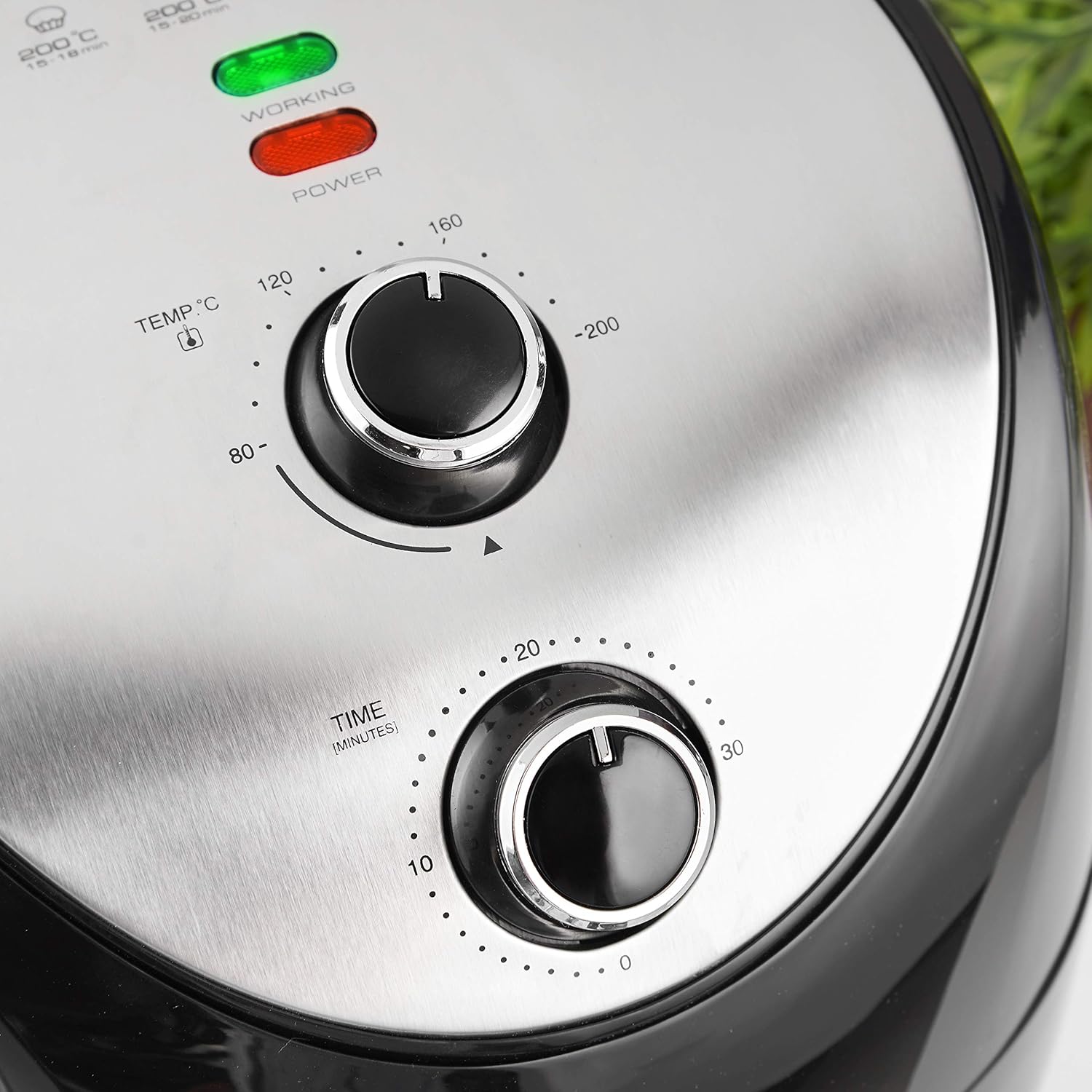 Close-up of air fryer temperature and timer dials