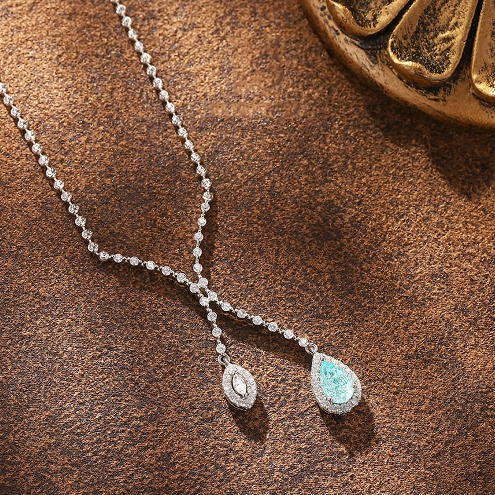 Łańcuszek przyjaźni damski, łańcuszek na szyję z wisiorkiem Infinity z turmalinem Paraiba i moissanit 18-karatowe białe złoto 45 cm