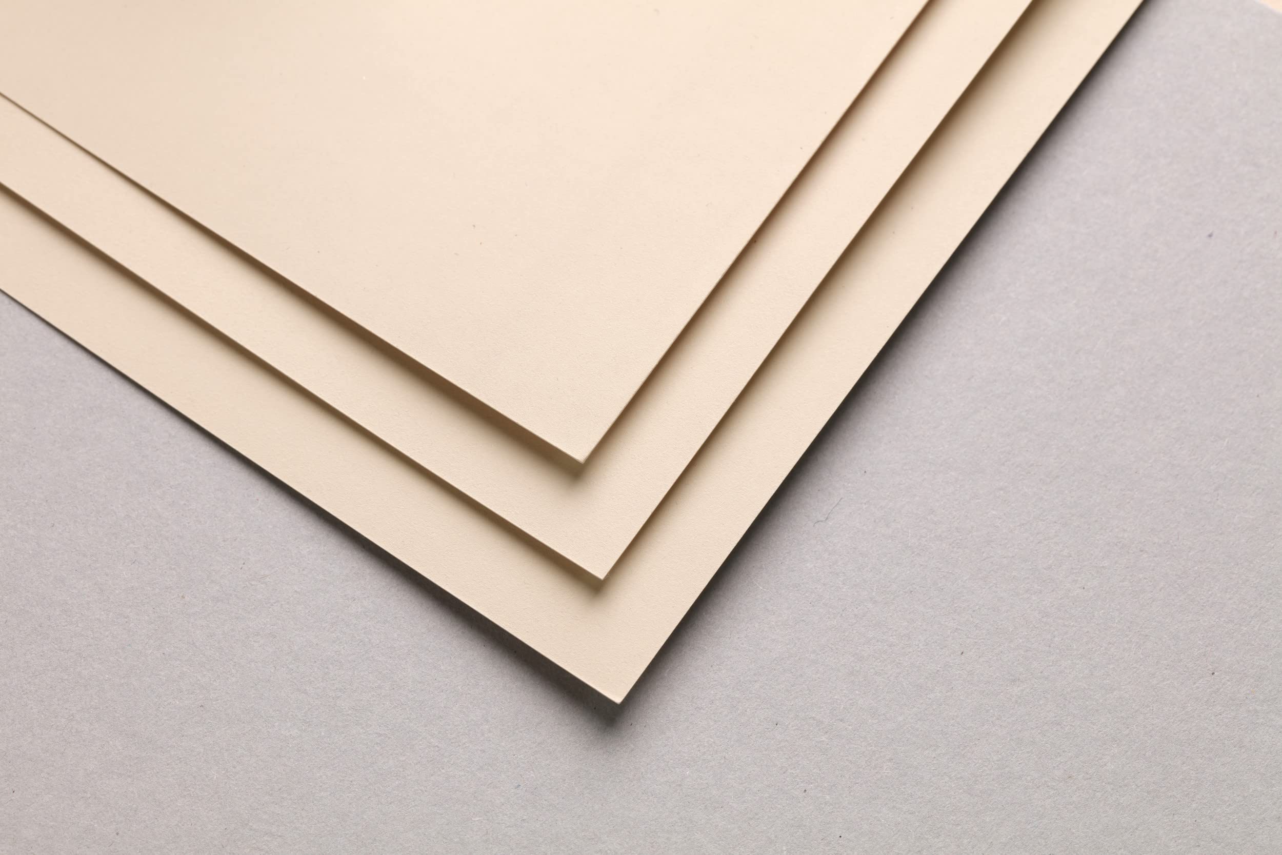 The blue coating on the back prevents the paint from bleeding through the paper.