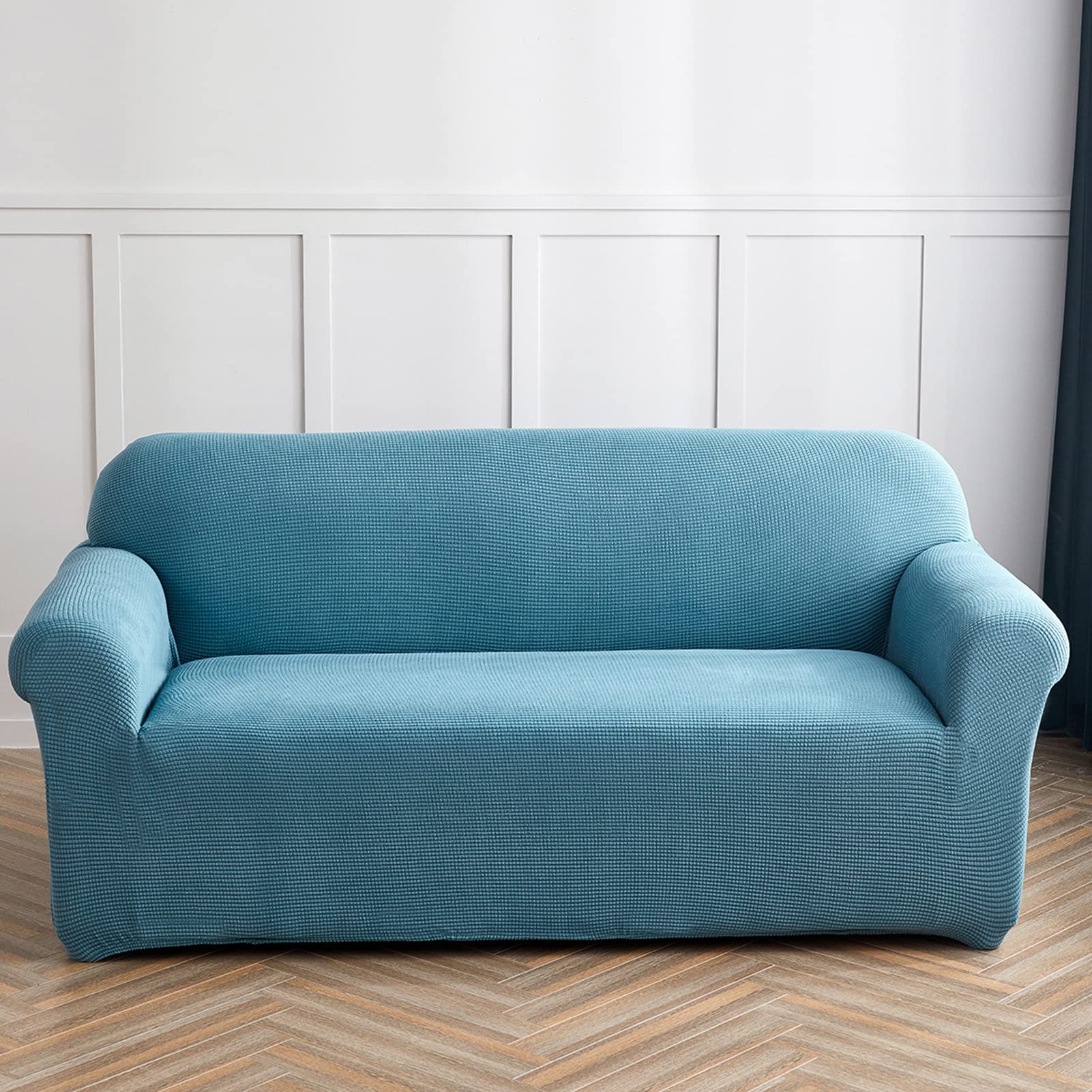 Housse de canapé bleu pour protéger le fauteuil du salon familial