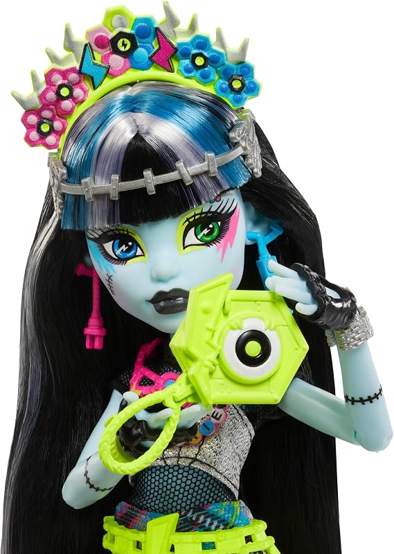 Monster High Frankie Stein Doll with Glamorous Monster Festival Outfit and Festival Accessories such as Sacks Ribbon Poster Statement Bag and More HXH79
