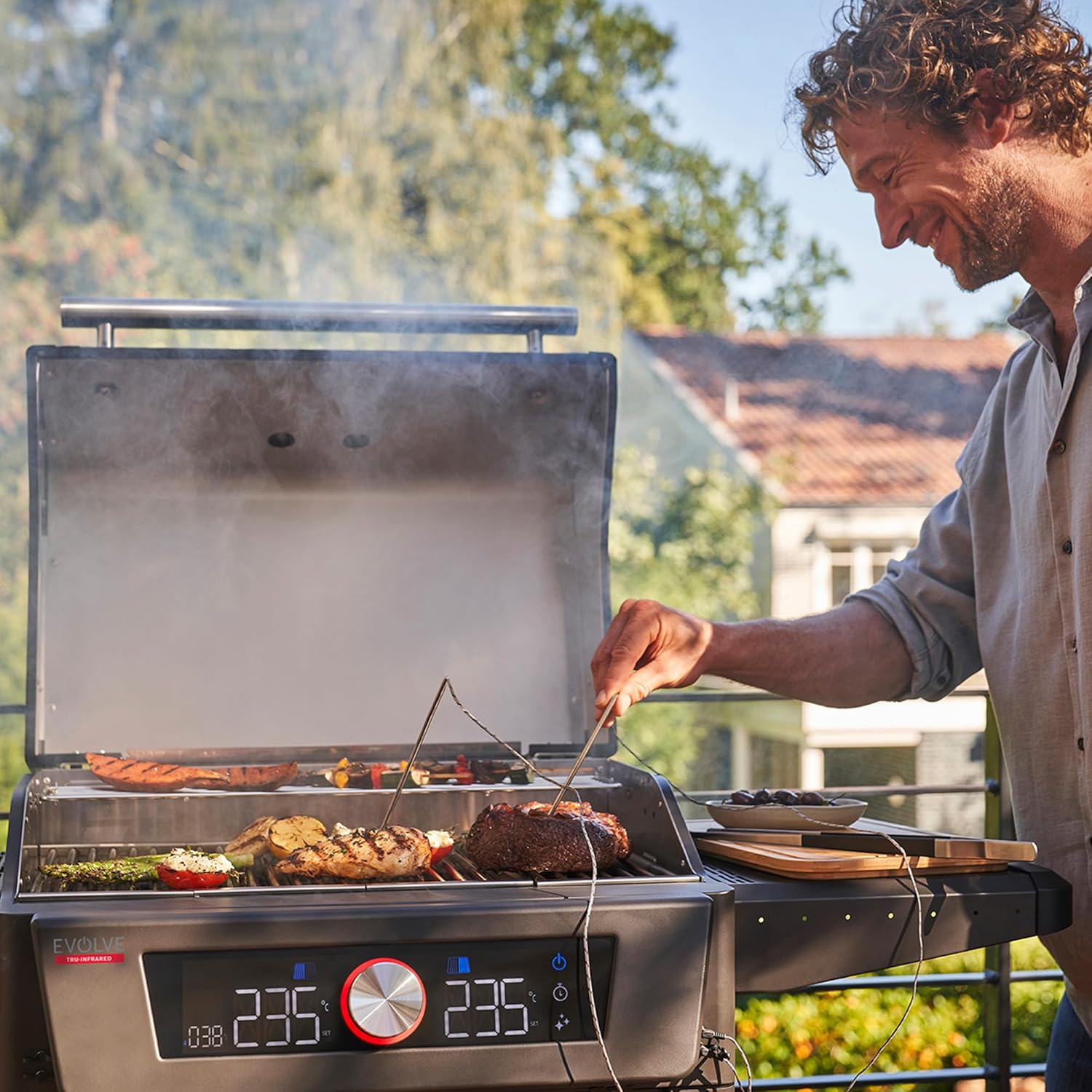 Smartphone displaying the Char-Broil app interface for grill control