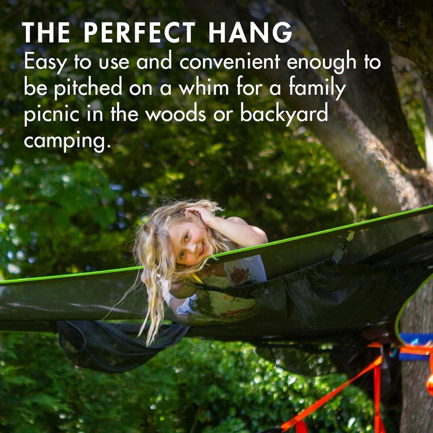 A child relaxing comfortably in a Tentsile Trillium Hammock
