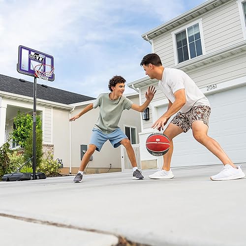 Vista 43 de Aro de basketball con sistema portable, de altura ajustable, tablero posterior de 44 pulgadas de Lifetime 1269 Pro Court.