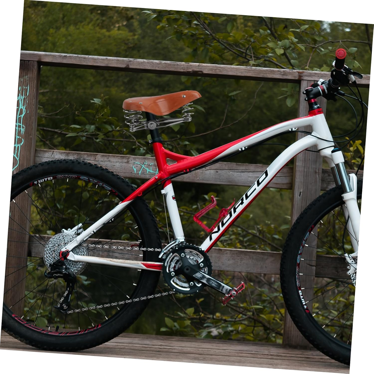 Shockproof Bike Seat Faux Leather Cycling Saddle with Ergonomic Pressure Relief Compatible with Mountain Road Exercise Bikes Comfortable Replacement Cushion for Random Color