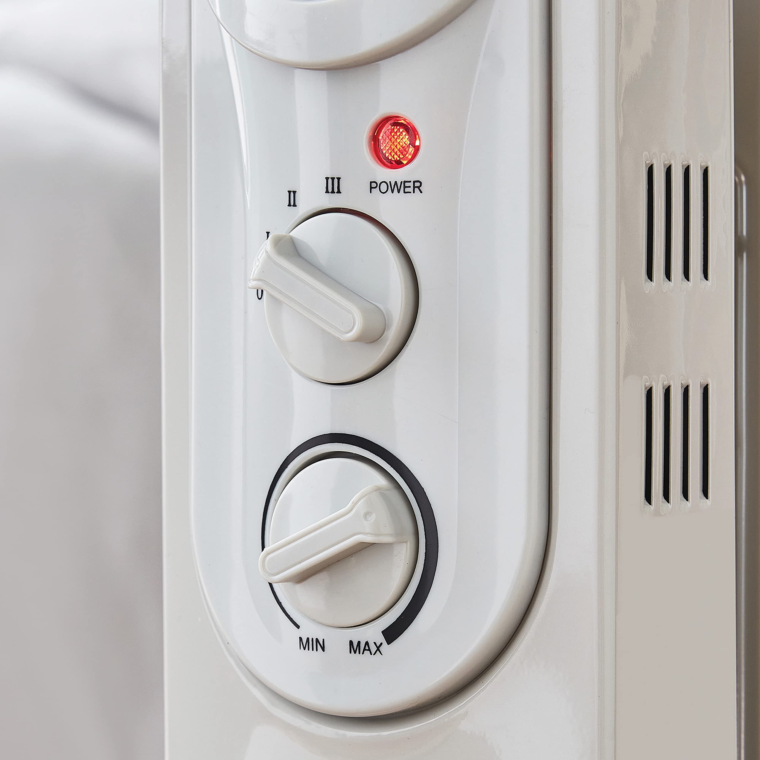 Silentnight 7-Fin Oil Filled Radiator with Timer, 1500 Watt, 38140, White,  L67.5(cm) x W14(cm) x H38.5(cm) : Amazon.co.uk: DIY u0026 Tools
