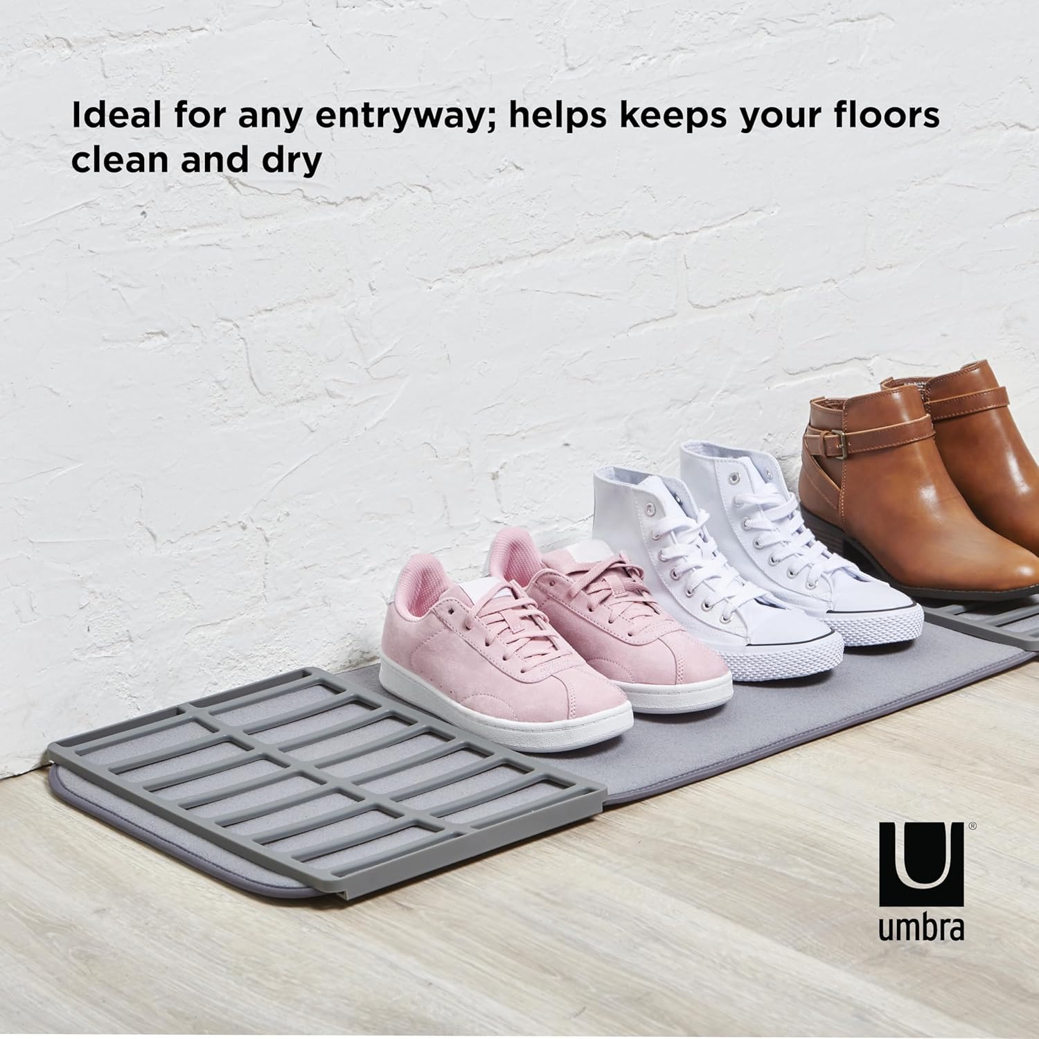 Umbra ShoeDry mat in an entryway with shoes on it