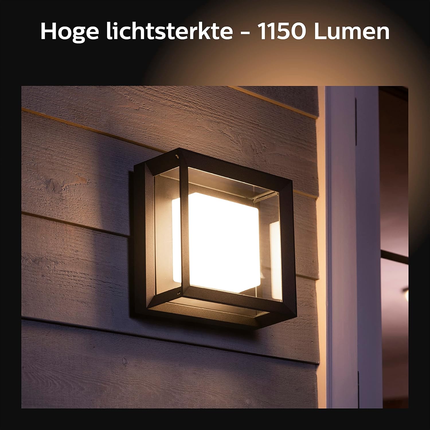 Philips Hue Econic light installed on a wooden wall, emitting bright white light, with text 'High light intensity - 1150 Lumen'.